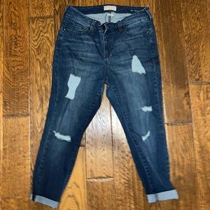 Medium dark wash jeans with manufactured rips